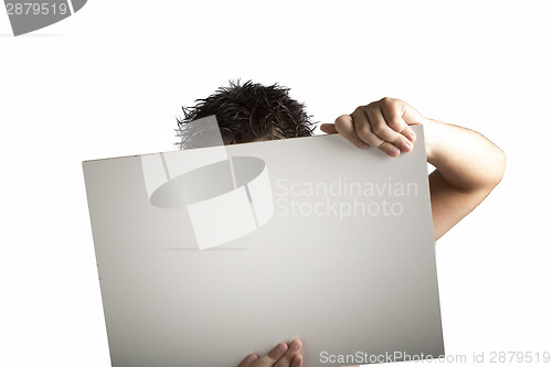 Image of White Plastic laminate sign held up by hands