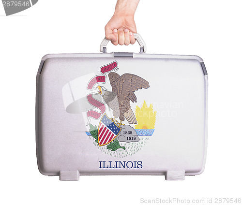 Image of Used plastic suitcase with stains and scratches