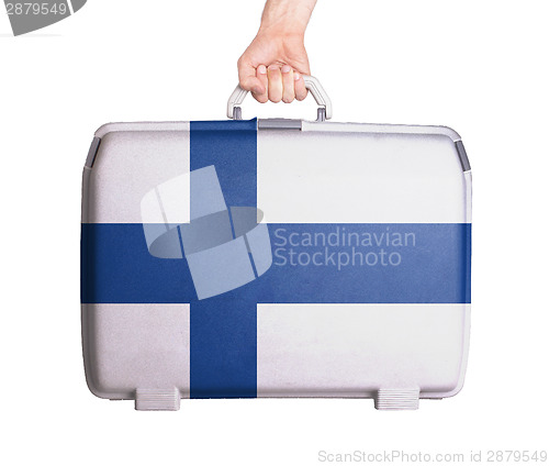 Image of Used plastic suitcase with stains and scratches