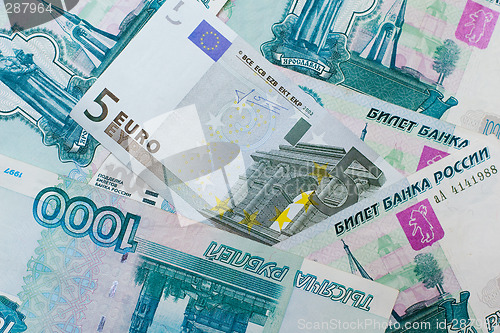 Image of Euros and Russian roubles banknotes