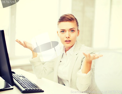 Image of stressed businesswoman with computer