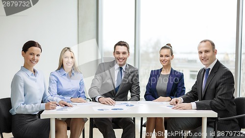Image of smiling business team at meeting