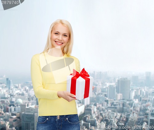 Image of smiling girl with gift box