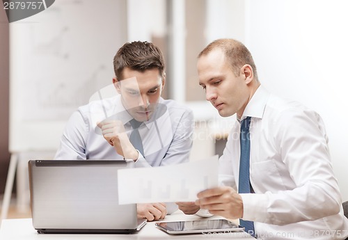 Image of two businessmen having discussion in office