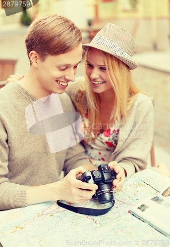 Image of smiling couple with photo camera