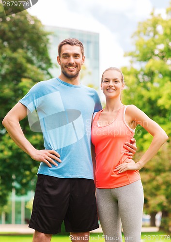 Image of smiling couple outdoors