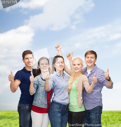 Image of group of smiling students showing thumbs up