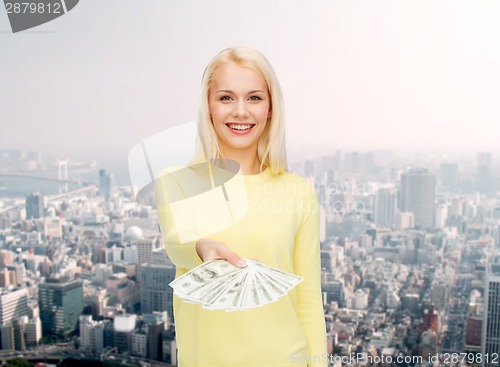 Image of smiling girl with dollar cash money