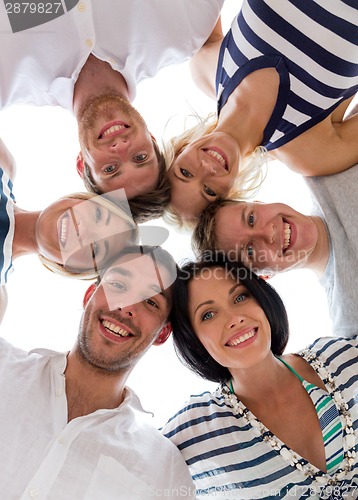 Image of smiling friends in circle