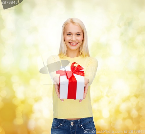 Image of smiling girl with gift box