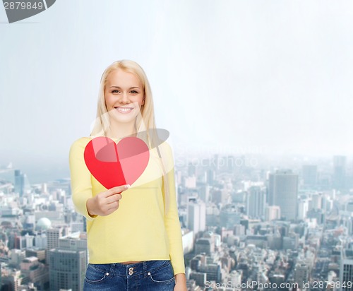 Image of smiling woman with red heart