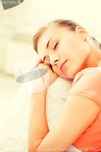 Image of woman sleeping on the couch at home