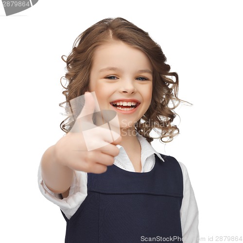 Image of pre-teen girl showing thumbs up