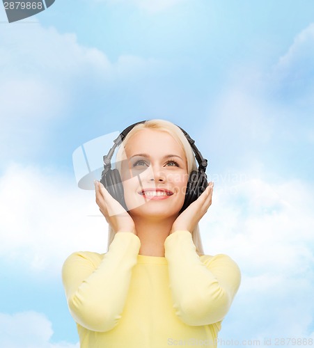 Image of smiling young woman with headphones