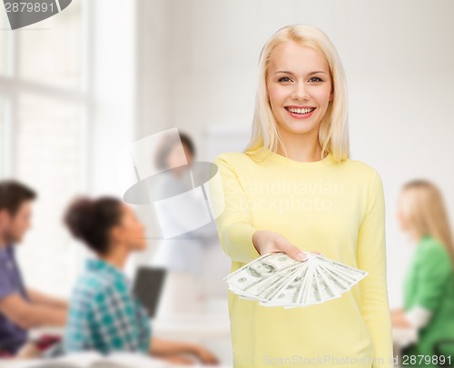 Image of smiling girl with dollar cash money