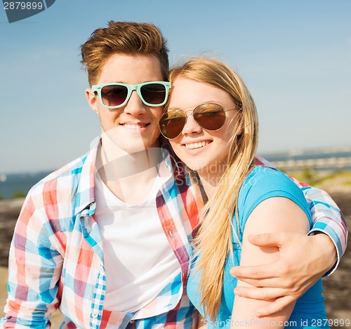 Image of smiling couple having fun outdoors
