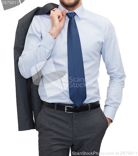 Image of handsome buisnessman with jacket over shoulder