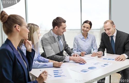 Image of smiling business team at meeting