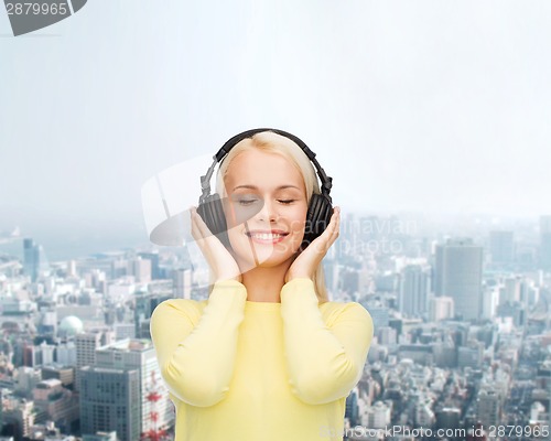 Image of smiling young woman with headphones