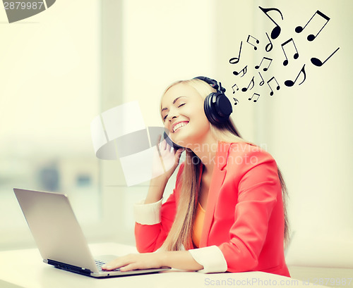 Image of happy woman with headphones listening to music