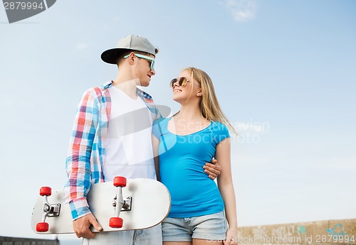 Image of smiling couple having fun outdoors