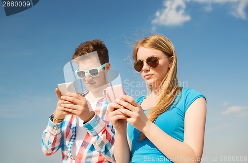 Image of smiling couple having fun outdoors