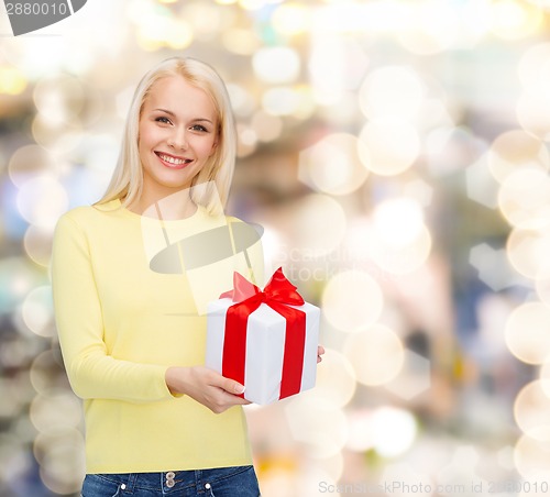 Image of smiling girl with gift box
