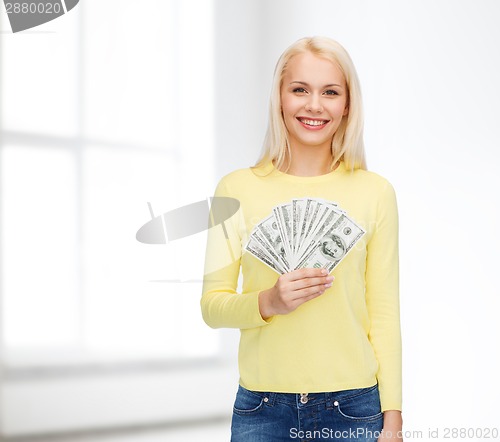 Image of smiling girl with dollar cash money