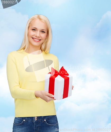 Image of smiling girl with gift box