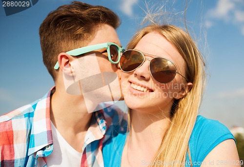 Image of smiling couple outdoors