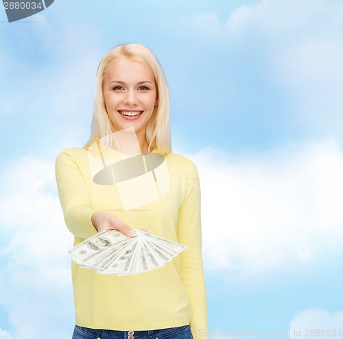 Image of smiling girl with dollar cash money