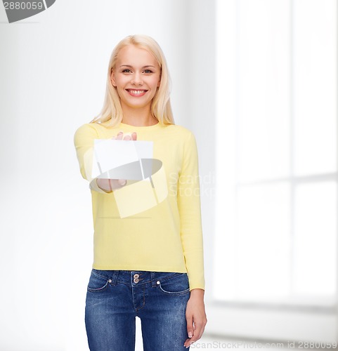 Image of smiling girl with blank business or name card