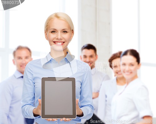 Image of businesswoman with blank black tablet pc screen