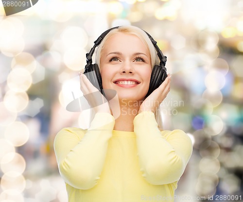 Image of smiling young woman with headphones