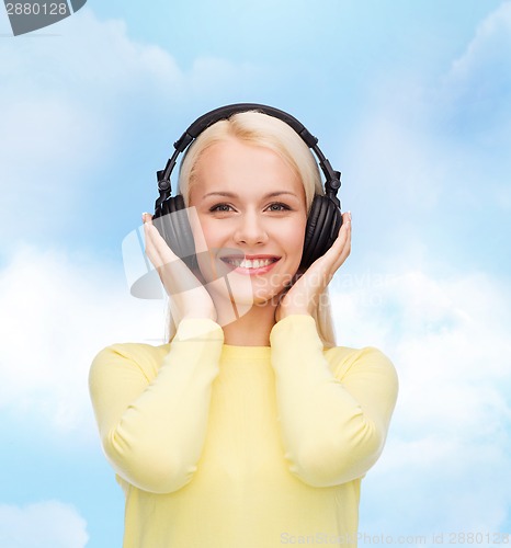 Image of smiling young woman with headphones