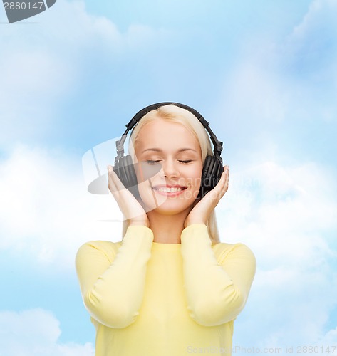 Image of smiling young woman with headphones