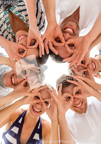 Image of smiling friends in circle