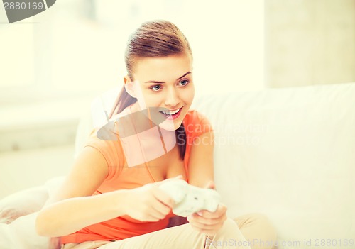 Image of woman with joystick playing video games