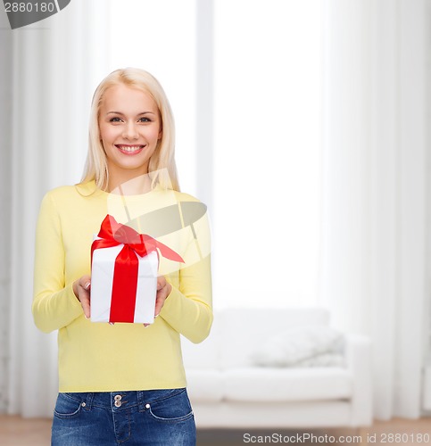 Image of smiling girl with gift box