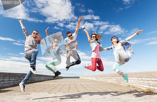 Image of group of teenagers jumping