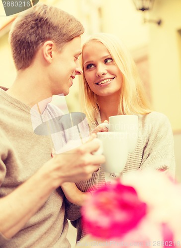 Image of romantic happy couple in the cafe