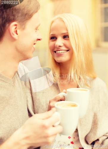 Image of romantic happy couple in the cafe