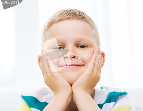 Image of smiling little student boy at home