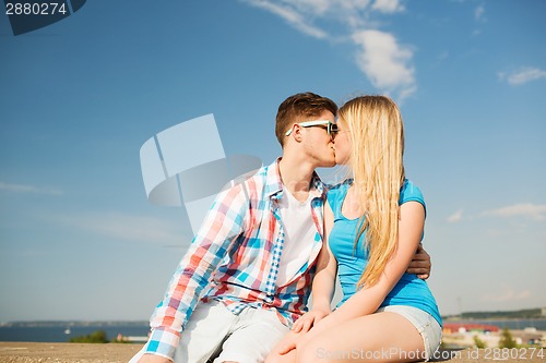 Image of smiling couple outdoors