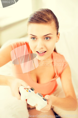 Image of woman with joystick playing video games