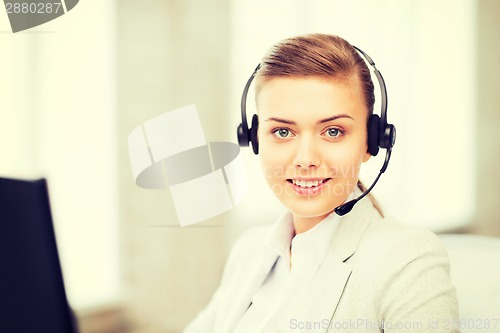 Image of female helpline operator with headphones