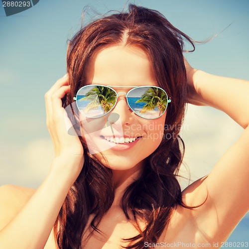 Image of woman in sunglasses