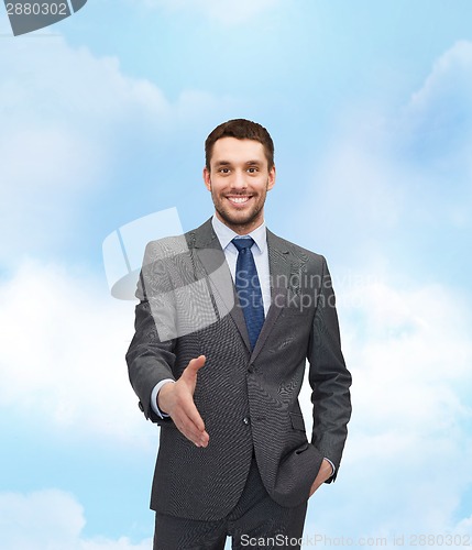 Image of businessman with open hand ready for handshake