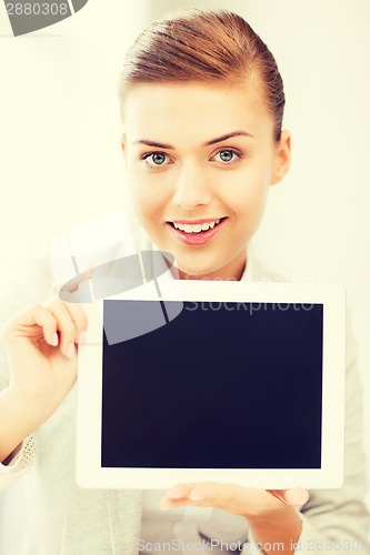 Image of businesswoman with tablet pc in office