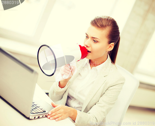 Image of strict businesswoman shouting in megaphone